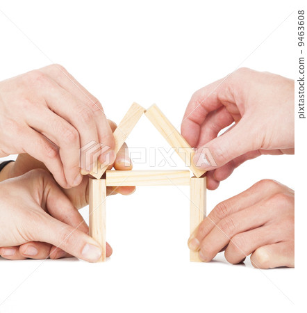 five businessman's hand building house by wooden block five businessman's hand building house by wooden block 9463608