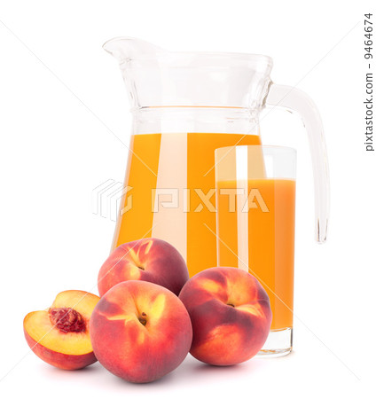 Peach fruit juice in glass jug Peach fruit juice in glass jug 9464674