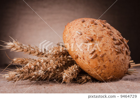 Loaf of bread and wheat ears still life 9464729