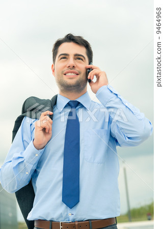 Businessman using phone on travel Businessman using phone on travel 9464968