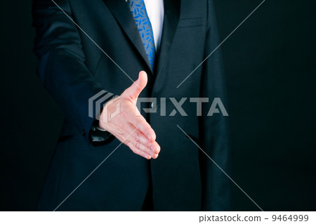 Business man in suit offering handshake 9464999