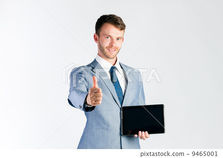 Businessman presenting tablet computer 9465001