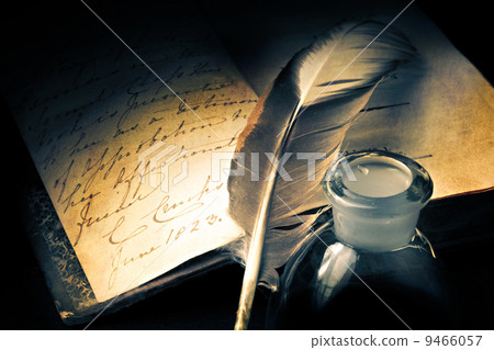Old book with feather 9466057