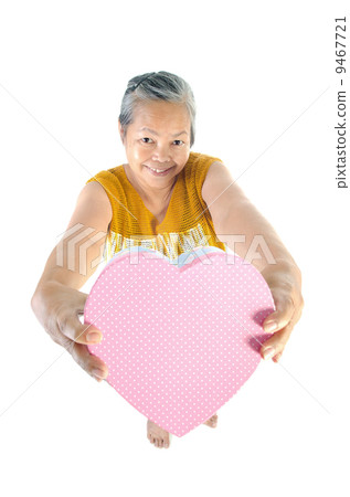 Asian Senior woman holding a gift box Asian Senior woman holding a gift box 9467721