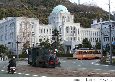 Botchan trains and trams going in front of the prefectural government 9467809