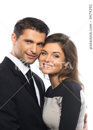 Beautiful young couple in suit and dress isolated on white background 9474391