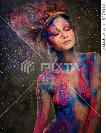 Young woman muse with creative body art and hairdo 9474526