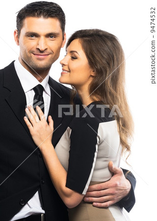 Beautiful young couple in suit and dress isolated on white background Beautiful young couple in suit and dress isolated on white background 9474532