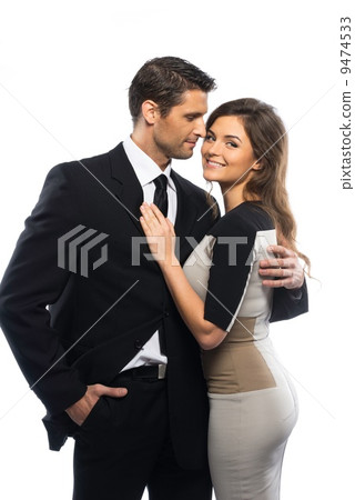 Beautiful young couple in suit and dress isolated on white background Beautiful young couple in suit and dress isolated on white background 9474533