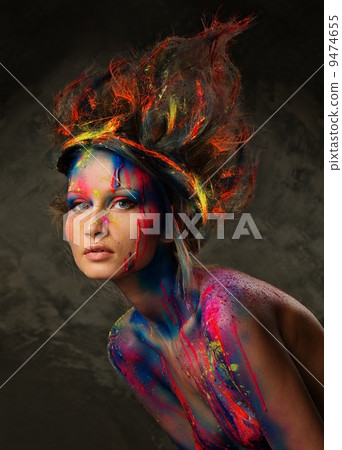 Young woman muse with creative body art and hairdo 9474655