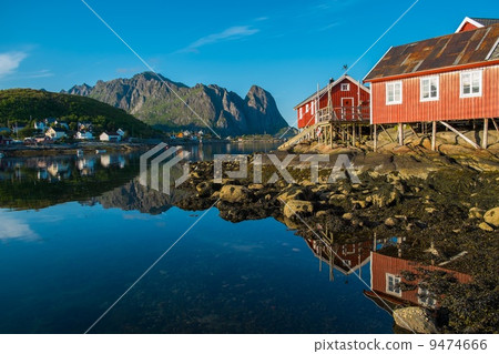 Traditional wooden houses against in Reine village, Norway Traditional wooden houses against in Reine village, Norway 9474666