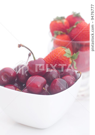 Cherries and strawberry in a ceramic and glass bowl isolated on Cherries and strawberry in a ceramic and glass bowl isolated on 9476777
