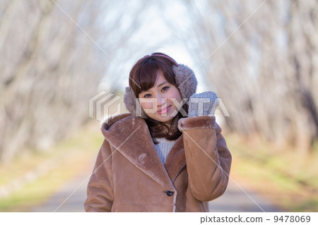 A woman giving a gift A woman giving a gift 9478069