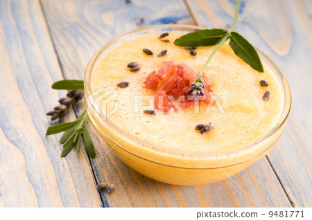 fresh melon soup with parma ham and lavender flower 9481771