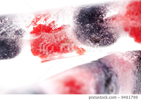 Raspberry and blackberry frozen in ice sticks 9481799
