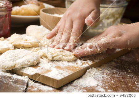 Detail of hands kneading dough Detail of hands kneading dough 9482003