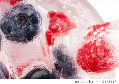 Raspberry and blackberry frozen in ice sticks Raspberry and blackberry frozen in ice sticks 9483557