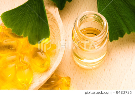 ginko biloba essential oil with fresh leaves - beauty treatment 9483725