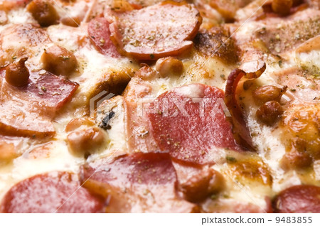 Italian pizza with bacon, salami and mozzarella cheese Italian pizza with bacon, salami and mozzarella cheese 9483855