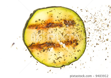 Grilled organic zucchini slices with herbs and spices Grilled organic zucchini slices with herbs and spices 9483912