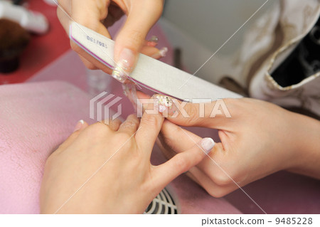 manicure process on female hand manicure process on female hand 9485228