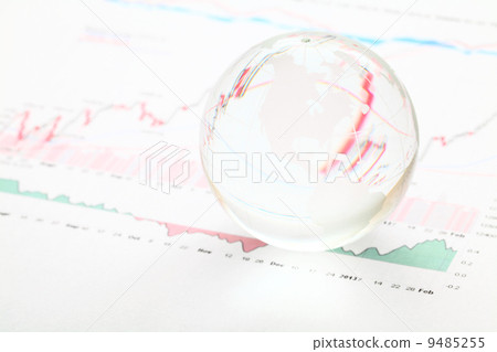 Glass earth ball on the financial chart 9485255
