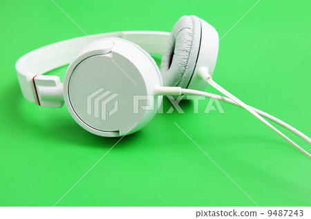 Headphone over green background 9487243