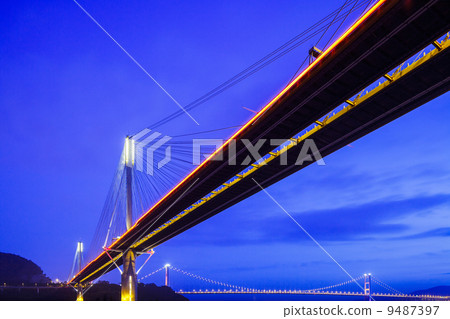 Suspension bridge in Hong Kong at night 9487397