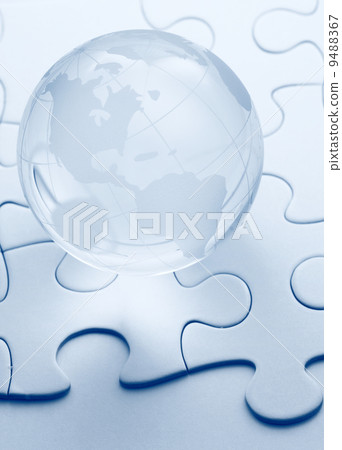 glass globe with puzzle background 9488367