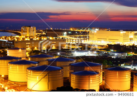 Oil tank in cargo service terminal at night 9490681