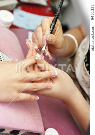manicure process on female hand 9491322