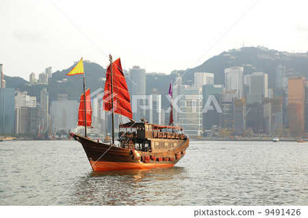 Hong Kong harbour with tourist junk 9491426
