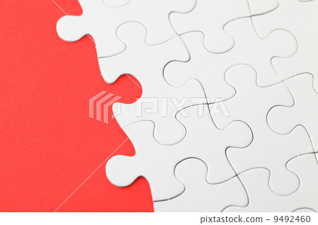 Puzzle with missing part on red background 9492460