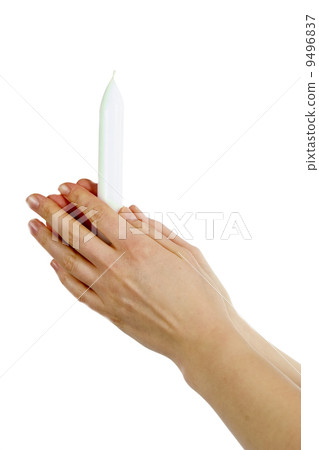 Holding Candle in Prayer 9496837