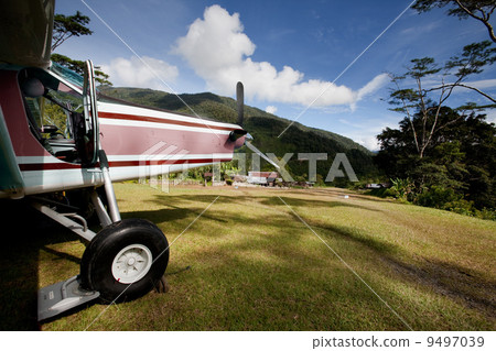 Airplane on Mountain Runway 9497039