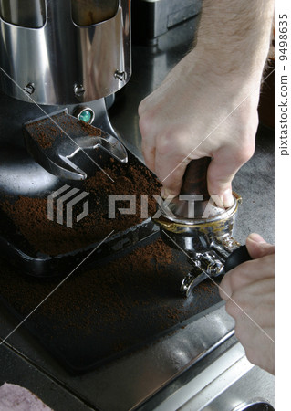 Tamping Espresso Grounds 9498635