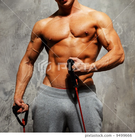Handsome man with muscular body doing fitness exercise Handsome man with muscular body doing fitness exercise 9499666
