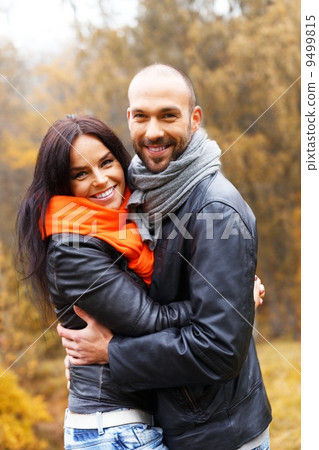 Happy middle-aged couple outdoors on beautiful autumn day 9499815