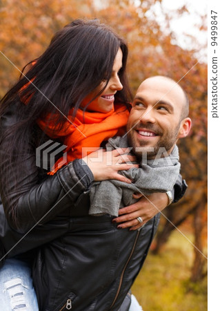 Happy middle-aged couple outdoors on beautiful autumn day Happy middle-aged couple outdoors on beautiful autumn day 9499847