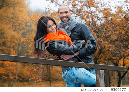 Happy middle-aged couple outdoors on beautiful autumn day Happy middle-aged couple outdoors on beautiful autumn day 9500277