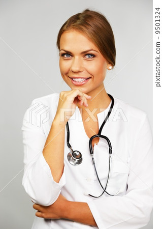 Beautiful young female doctor with stethoscope 9501324