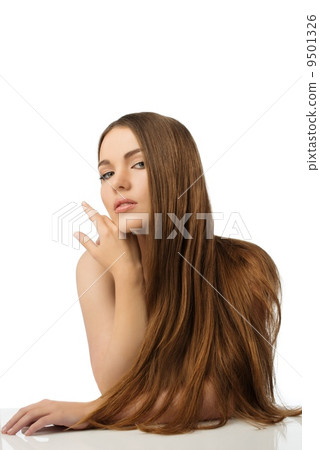 Beautiful young girl with long hair isolated on white 9501326