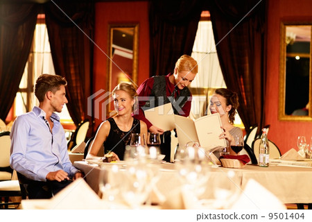 Group of young friends with choosing in a luxury restaurant Group of young friends with choosing in a luxury restaurant 9501404