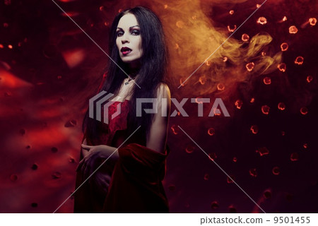 Beautiful vampire woman in red dress Beautiful vampire woman in red dress 9501455