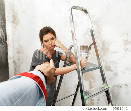 Man's hand pouting on a disgruntled woman worker Man's hand pouting on a disgruntled woman worker 9501641