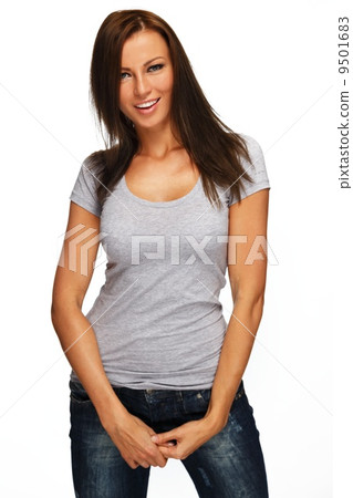 Young positive brunette girl with long hair wearing t-shirt and jeans Young positive brunette girl with long hair wearing t-shirt and jeans 9501683