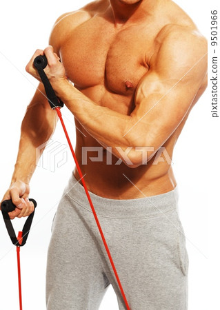 Handsome man with muscular body doing fitness exercise Handsome man with muscular body doing fitness exercise 9501966