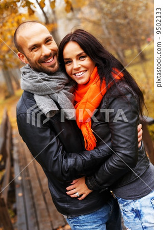Happy middle-aged couple outdoors on beautiful autumn day Happy middle-aged couple outdoors on beautiful autumn day 9502133
