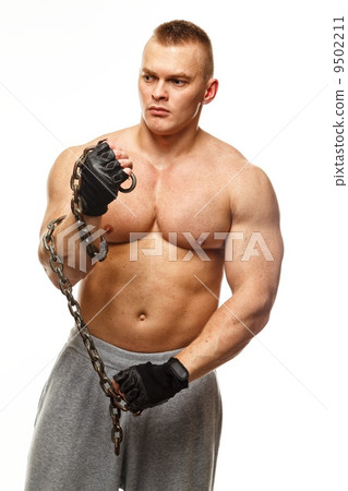 Handsome young muscular man with chain 9502211