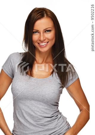 Young positive brunette girl with long hair wearing t-shirt 9502216